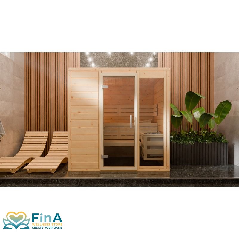 Frieda Indoor sauna from FinA Wellness with elegant glass front, light-colored spruce wood walls and reclining benches in a stylish wellness area with plants